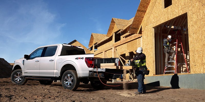 Construction workers used the bed of a Ford F-150 to work.