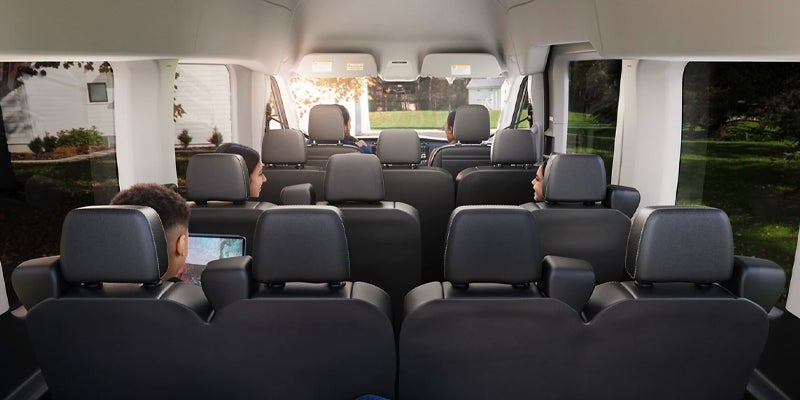 Interior view of the seating in a Ford Transit van.